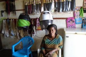 Miriam in Uganda received a loan of $200 to buy hair dryers and supplies for her beauty salon.