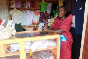 Rebecca in Uganda received $225 from iZosh to buy supplies for her business making clothing for families.