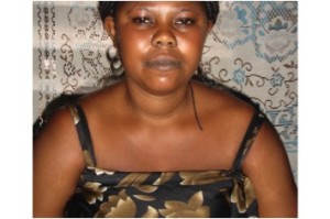 Esther from Ghana received a loan to buy textiles and sewing accessories for designing and sewing garments.