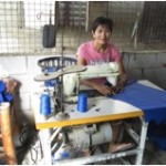 Teresita from the Philippines received a loan to buy a new sewing machine to make bags, blankets and curtains to sell.