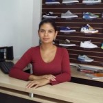 A loan of $900 helped Monica Johana buy a lot more shoes to stock up and to have more variety to offer.