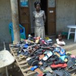 Betty in Uganda received a loan of $200 to increase her shoe inventory in her business in a trading center.