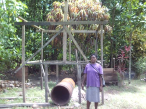 Gladys in the Solomon Islands received a loan of $900 to buy drums, spades, wheelbarrows, and timber to make an additional cocoa dryer for her cocoa drying and selling business.