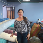 Luz in Columbia received a loan of $1050 to buy rolls of fabric, elastic, appliqués, lace and other supplies for her sewing business.