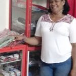 Maria in Columbia received a loan of $225 to buy bulk goods to sell in her general store.