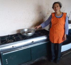 Rosa Elina in Ecuador received a loan of $500 to buy instant coffee, flour, eggs, and butter for her business selling coffee with empanadas and tortillas.